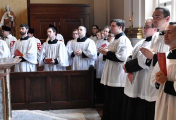 Seminarians from St. Charles Borromeo Seminary pray during the ceremony. (Photo by John Simitz.)