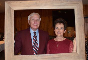 Manny and Jane Lanzos, parishioners of St. Joseph, enjoy some fun at the reception.