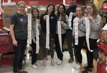 Students go with Massey to a local Target to purchase $29,000 worth of toys for numerous children’s hospitals, from left, Janell Massey, Olivia Ronca, Katherine Martinez, Holly Peslis, Caden Giordano, Jordan Judd and Elizabeth Lieb. 