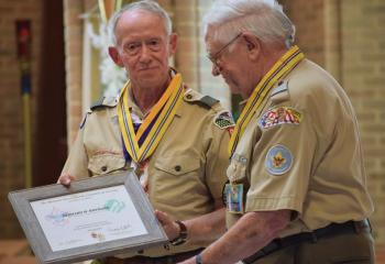 Fred Flemming awards Bernard Hofmann for his service.