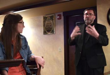 Emily Ickes, left, parishioner of St. Paul, Allentown, listens as Father Walsh fields questions about St. Ignatius of Loyola, who established the Society of Jesus.