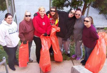 Having fun participating in the Great American Cleanup are, from left, case manager Ashley Blake, Lisa Painter, Caitlin Kasperowicz, Catina Mejia, Sara Dehaven, Autumn Yerger and Mary LaPrad.