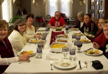 Celebrating Christmas with staff and residents are: Robin Ball, back left; Franciscan Sister Kathleen McMullin (now deceased), front left; and Franciscan Sister Eileen Doherty, front right.