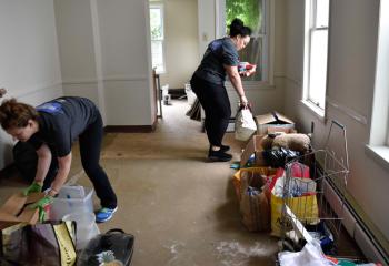 Jessica Down, left, and Alanna Dent clean and stack supplies at the kitchen and center, located at 179 Chew St. at the former Our Lady of Mount Carmel. 