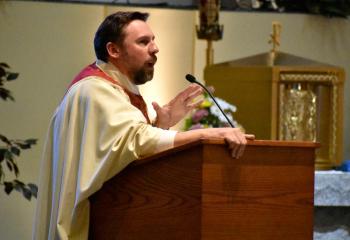 Father Sedar preaches the homily.