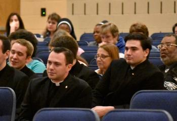 Seminarians, laity and religious listen to the morning presentation.