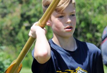Justin Abramo, Holy Family, Nazareth, prepares to throw the javelin.