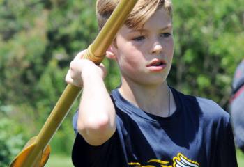 Justin Abramo, Holy Family, Nazareth, prepares to throw the javelin.