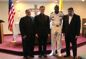 (Left to Right) Bishop Alfred Schlert, Fr. James Harper, Lt. Charles M. Banks, Jr. and Msgr. John Murphy.