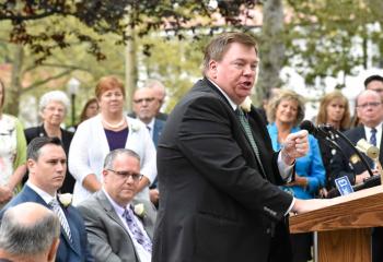“Science tells us faith helps us get into recovery and stay in recovery,” Lamont McClure tells the crowd.