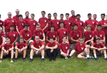 Father Searles, back right, joins diocesan seminarians and young men for a group photo.