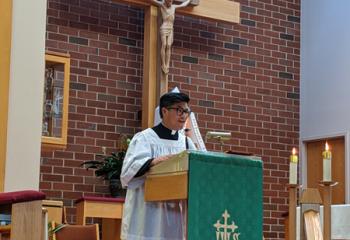 Mai shares his vocation story before one of the Holy Hours. (Photo by Susan Matour)