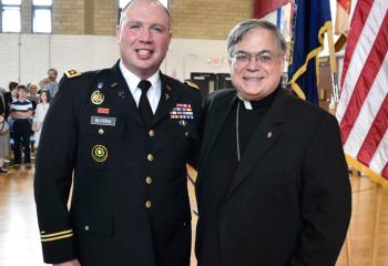 Bishop of Allentown Alfred Schlert, right, congratulates Father Butera.