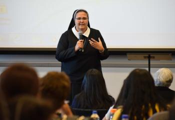 Sister Hermana Sophia Marie Peralta presents the Spanish tract address. (Photo by John Simitz)