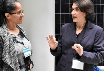 Martha Fernández-Sardina, Spanish presenter, right, chats with Pamela Patino. (Photo by John Simitz)