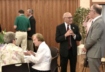 Members of the Legacy Society engage in conversation during brunch.