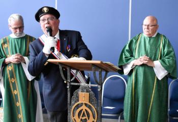 Dennis Sullivan welcomes those attending the dedication.