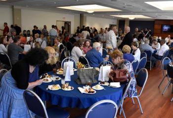 Parishioners of Holy Family and guests enjoy refreshments after the dedication.