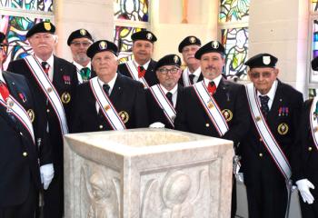 Knights of Columbus, donning the organization’s new uniform, gather before Mass.