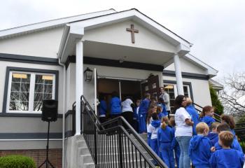 Students enter the new entrance of the school after the ceremony.