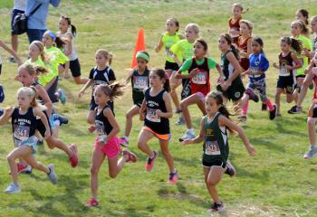 The start of the third-and fourth-grade girls’ race. “I think this event best lays out the mission of CYO. This is an open event to all parishes in the Diocese, which includes kids of all ages from K-8. There are kids of all different talent levels afforded the opportunity to compete and have fun. I see kids enjoying themselves whether they come in first or are the last one across the line. In my opinion just finishing the race makes every kid here a winner,” said Daniel Jones, CYO coordinator.
