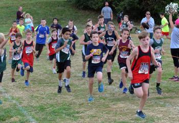 Fifth- and sixth-grade boys give it their all at the start of their race. (Photo by Ed Koskey)