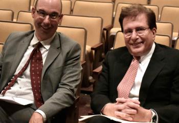 Tony Balistrere, deputy superintendent, left, chats with speaker Steven Virgadamo.