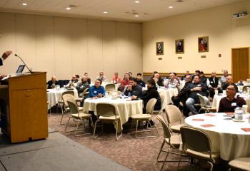 Seminarian Matthew Kuna talks to the Spanish group about vocations.