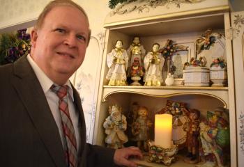 At another home on the tour, John D’Angelo shows his Santa and choir collection.