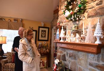 Janet Demansky and Tom Walsh take in the decorations at the home of John D’Angelo.