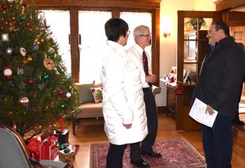 Attorney Anthony Muir, center, greets Tracy and Charlie Carbonetto as they visit his house. The tour was sponsored by the Cathedral Women’s Alliance. Proceeds were donated to numerous parish and community projects, such as the Ecumenical Soup Kitchen and Cedarbrook Nursing Home spiritual activities.