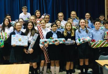 Our Lady of Perpetual Help students with gifts they wrapped.
