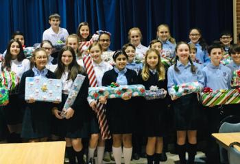 Our Lady of Perpetual Help students with gifts they wrapped.