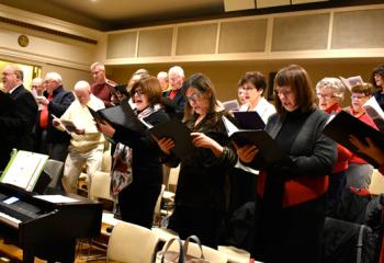 The choir sings before the Christmas Eve Mass. The liturgical season of Christmas begins with the vigil Masses on Christmas Eve and concludes on the Feast of the Baptism of the Lord. During this season, we celebrate the birth of Christ into our world and into our hearts, and reflect on the gift of salvation that is born with him … including the fact that he was born to die for us.