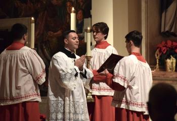 Seminarian Philip Maas reads a passage from during the time of Christ’s birth.