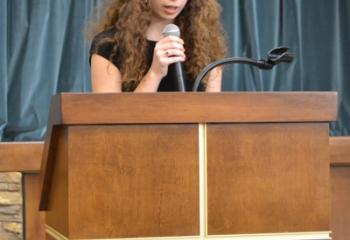 Katherine Joyce, Senior Division first place winner, reads her essay.