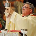 Bishop Alfred Schlert consecrates the Eucharist for the first time as Bishop of Allentown. (Photo by Ed Koskey)