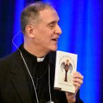 Father Ezaki suggests the book “Saints Behaving Badly” to men participating in the conference.