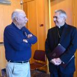 Bill Fonzone, left, parishioner of Holy Trinity, Whitehall, catches up with Bishop Ronald gainer, former pastor of the parish.