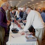 Participants and exhibitors gather during a break at Spirit 2013