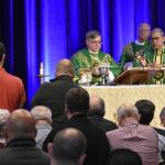 Bishop of Allentown Alfred Schlert, center, celebrates Mass at the Diocesan Men’s Conference. From left are: Deacon Hernandez; Deacon Michael Doncsecz, assigned to Queenship of Mary, Northampton; and Bishop Cisneros.