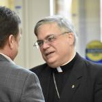 Bishop Schlert chats with one of the men participating in the conference.