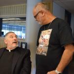  Monsignor John Campbell, left, pastor emeritus of Queenship of Mary, enjoys a conversation with Hector Lopez.