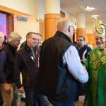 Bishop Schlert introduces himself to men attending the conference after Mass.