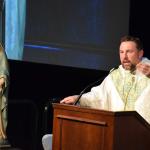 Father Adam Sedar preaches the homily at Mass.