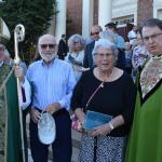 Bishop Schlert greets Father Frink and his parents, Murry and Geraldine Frink, who are celebrating their 70th year of marriage.