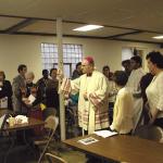 The Most Rev. Edward P. Cullen, D.D., Bishop of Allentown, blesses the faithful and the main dining hall of the new site of the Diocese’s Ecumenical Kitchen at Our Lady of Mount Carmel, Allentown, Jan. 4, 2004.