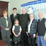 The Most Rev. Edward P. Cullen, D.D., Bishop of Allentown, gathers in Allentown in January 2004 with representatives of the various case elements that would each receive a portion of the more than $53 million raised in the Strengthening Our Future in Faith campaign: parish religious education; representing pastoral ministry and evangelization; education of future priests and permanent deacons, and the high schools; Catholic elementary schools; and local parishes and services for the elderly.