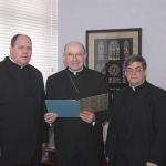Bishop Cullen reviews the decree dated Jan. 28, 2005 announcing the Second Synod of Allentown with, from left, the Rev. David L. James, who was slated to be General Secretary of the Synod and later named Vicar for Synod Implementation, and the Rev. Msgr. Alfred A. Schlert, J.C.L., V.G., diocesan Vicar General.