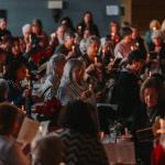 Women pray by candlelight and sing "silent night" at the 2024 Women's Advent Retreat